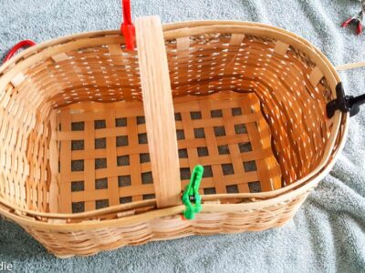 A basket on a towel with clips