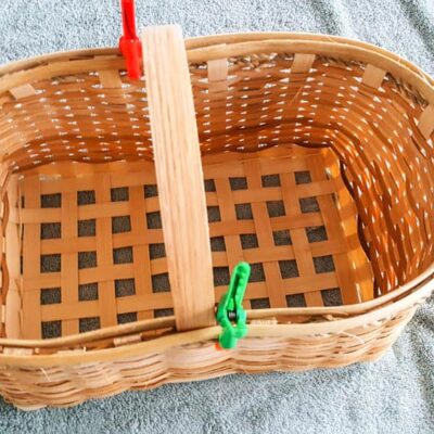 A basket on a towel with clips