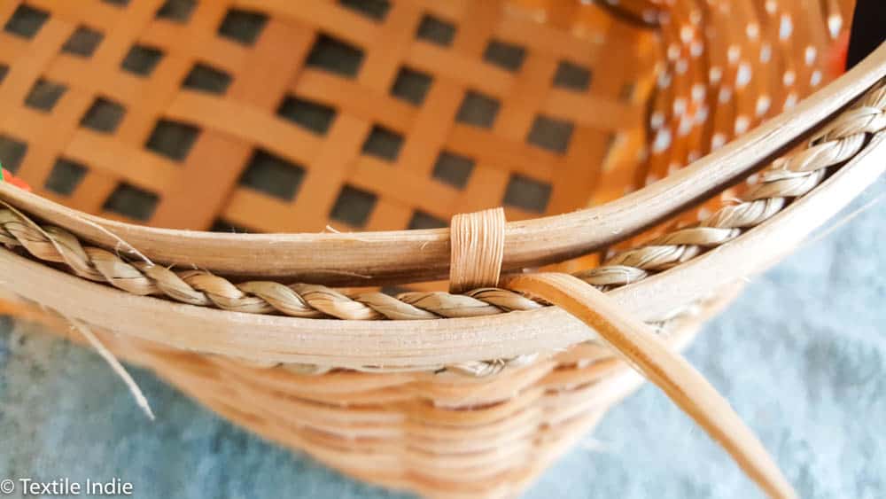 beginning the basic lashing on a basket rim