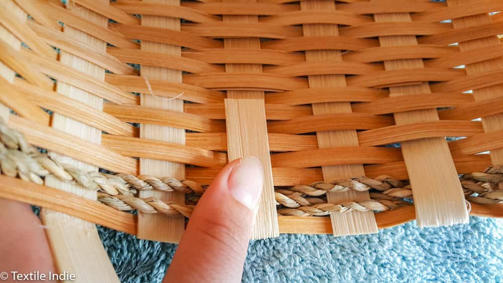 tucking the outside weavers into the basket 