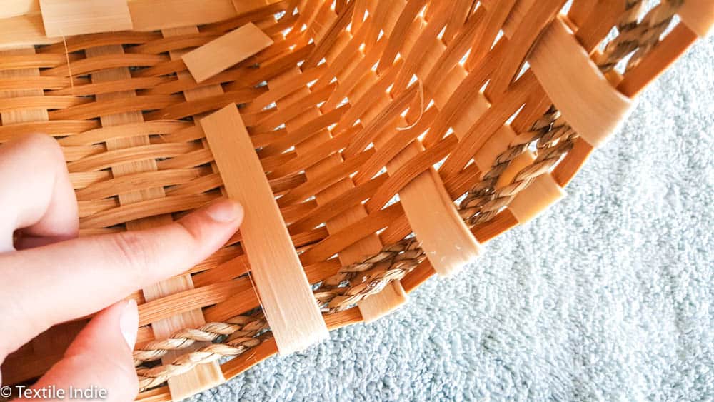 tucking the outside weavers into the basket 