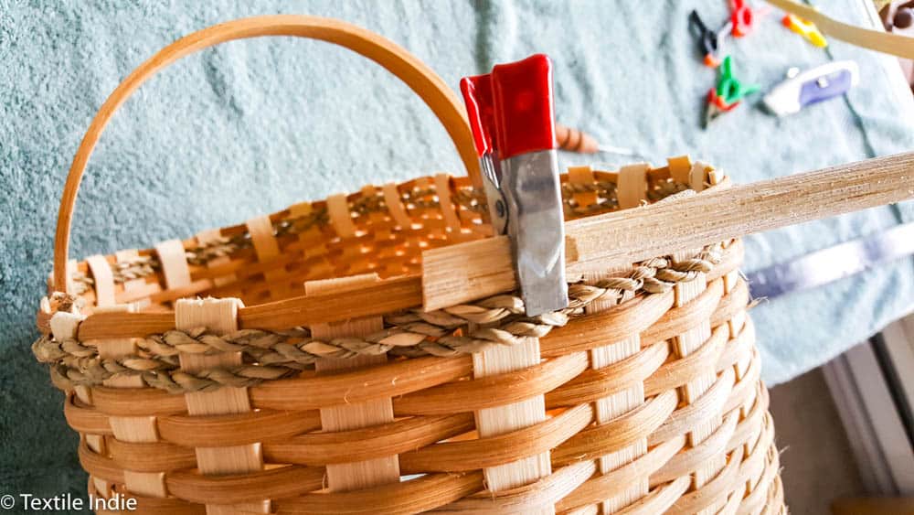 clamping the rim reed to the basket 