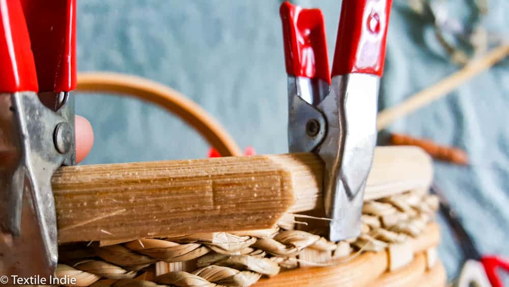 clamping the rim reed to the basket 