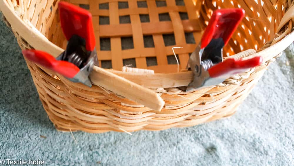 clamping the rim reed to the basket 