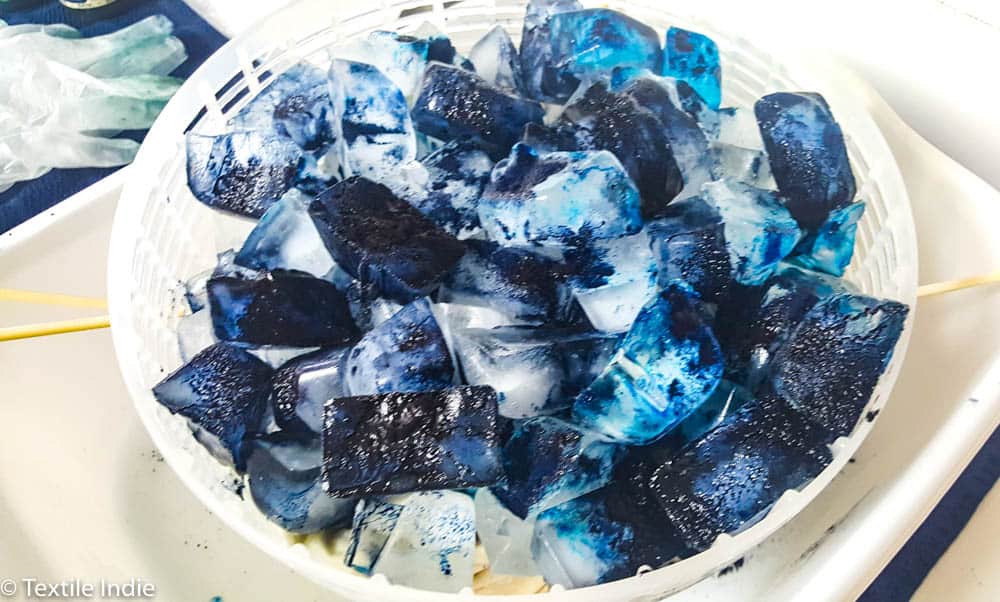 Bowl of dye covered ice cubes