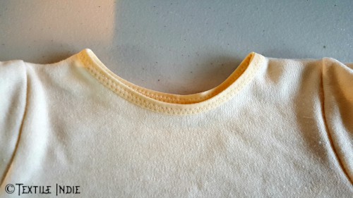 Neckline bound with fold over elastic