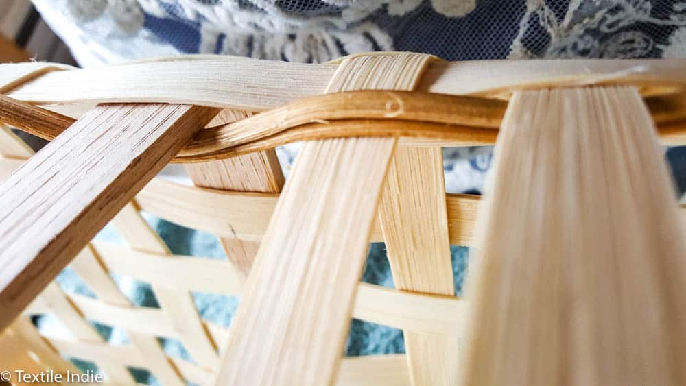 building the walls of a basket with a weaver
