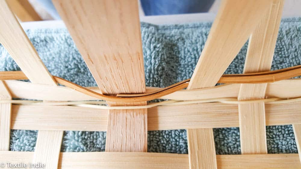 building the walls of a basket with a weaver 