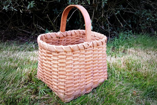 A walnut stained basket. 