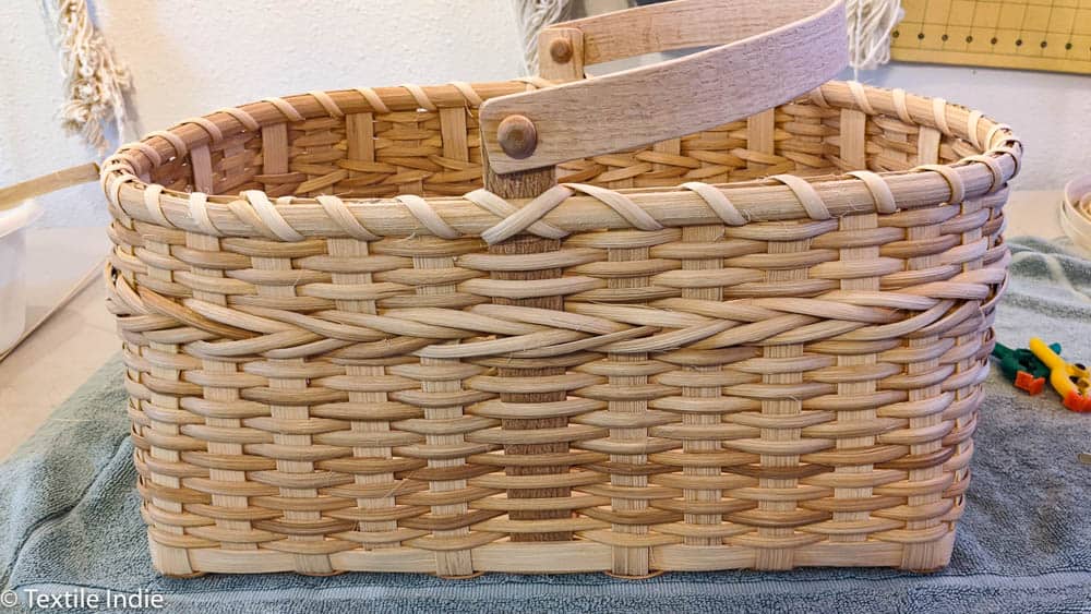 Braiding done in the weave of a handmade basket. 