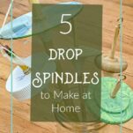 5 different handmade drop spindles in a vase
