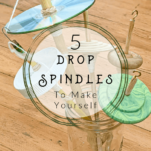 5 different handmade drop spindles in a vase