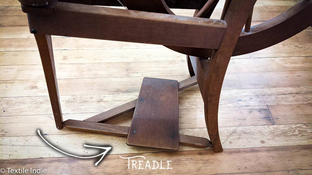 An Ashford Traditional Spinning wheel, detail view of the treadle 