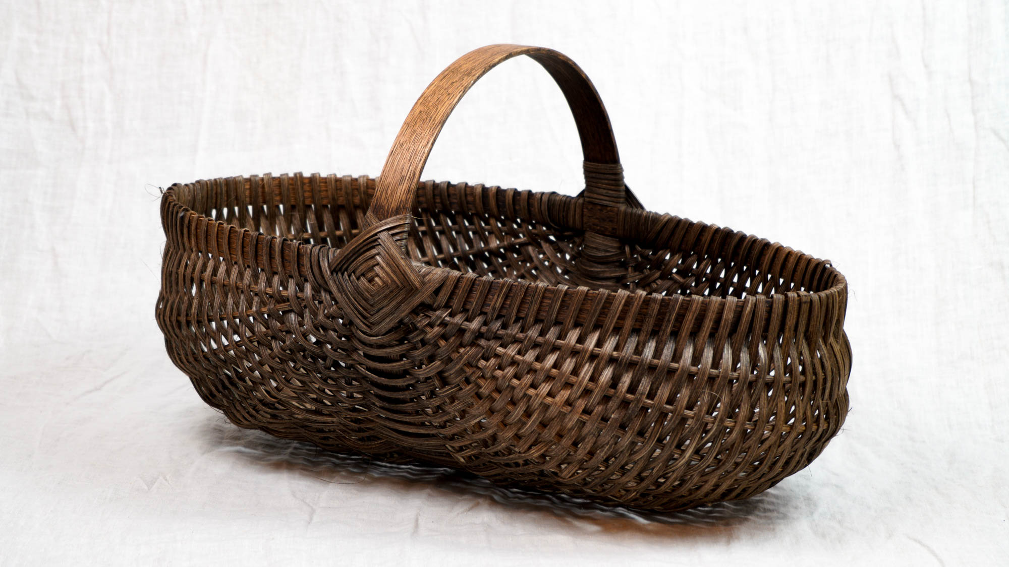 handwoven basket with walnut dye 