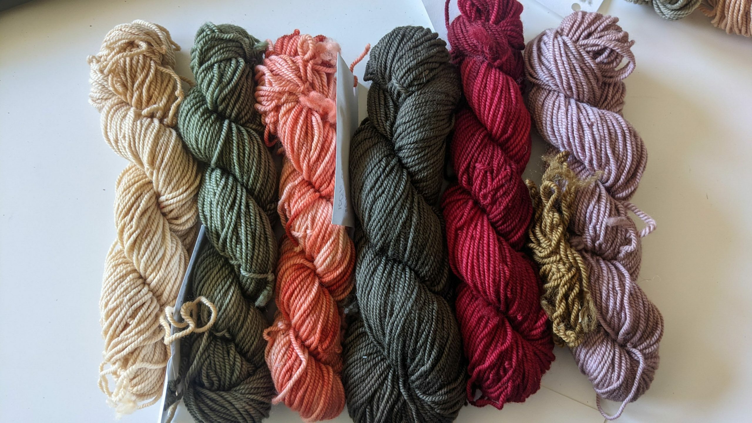 a row of brightly dyed wool yarn
