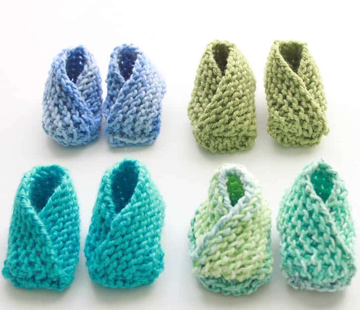 knit baby booties in a variety of green and blue hues