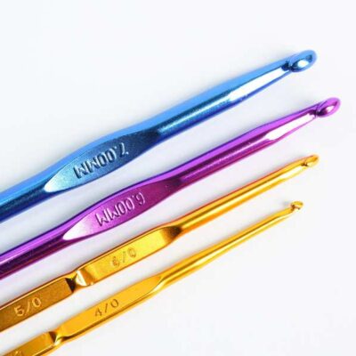 series of crochet hooks in a row - blue, pink, gold, yellow