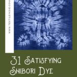 A indigo Shibori dyed cloth spread out flat, the pattern is a turtle.