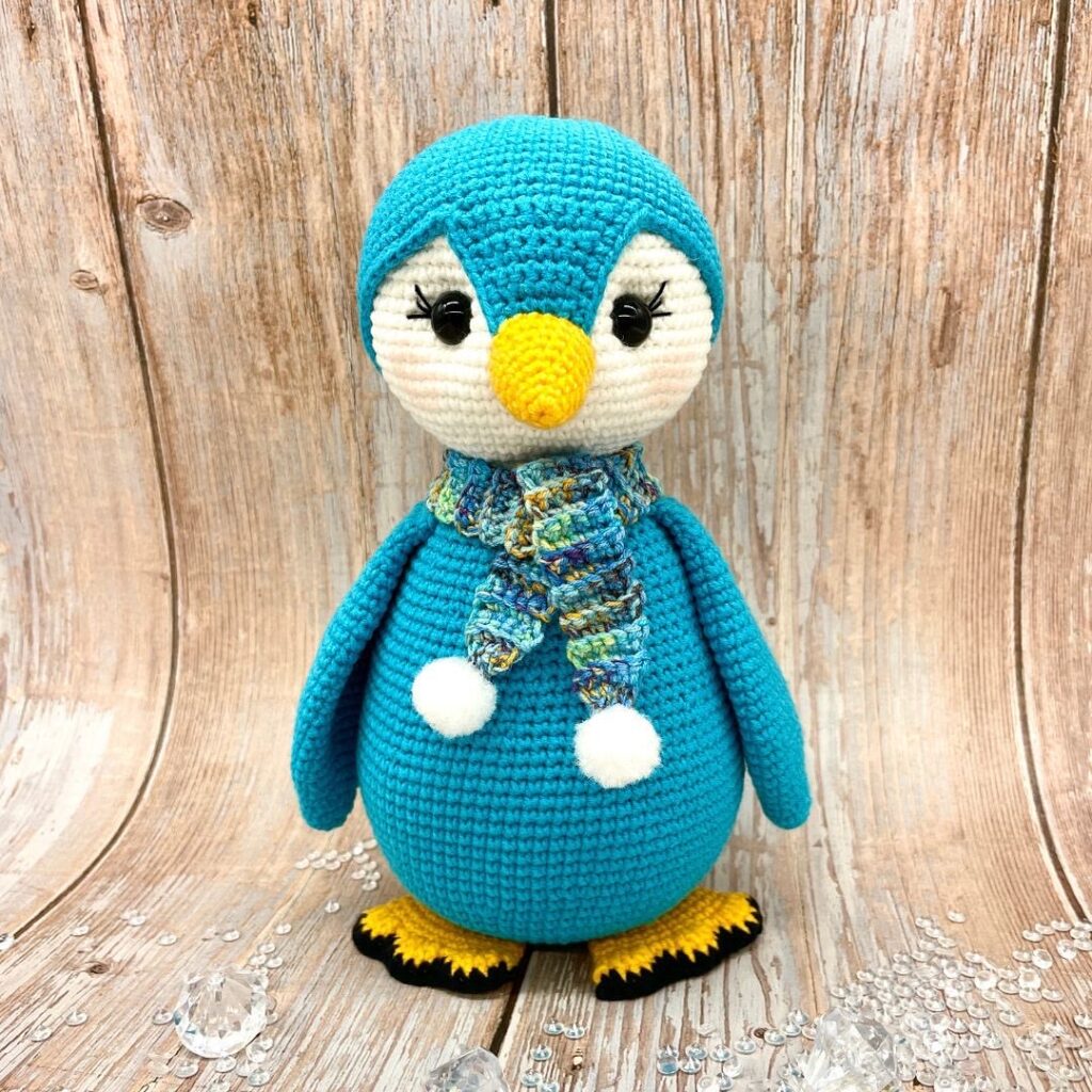 Cuddly Stitches Craft crochet penguin in turquoise 