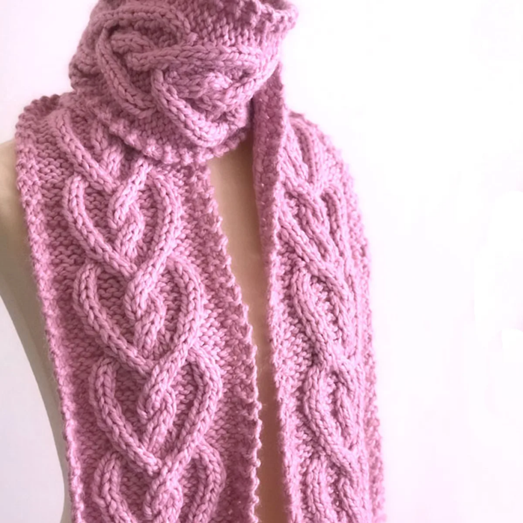 Studio Knit Celtic Heart cable knit scarf knit in a creamy pink color 