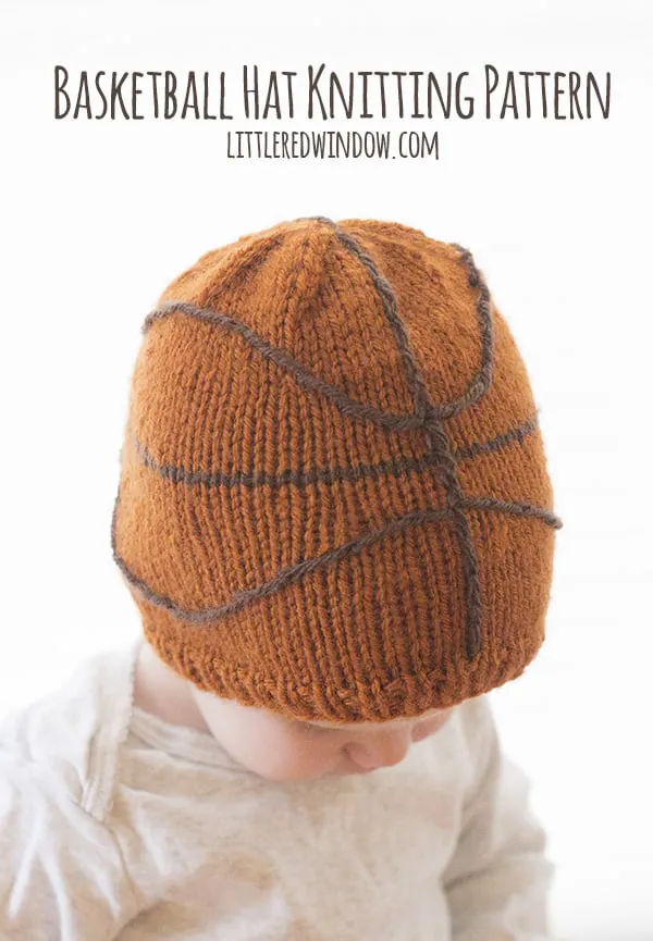 baby wearing a knitted basketball pattern hat 