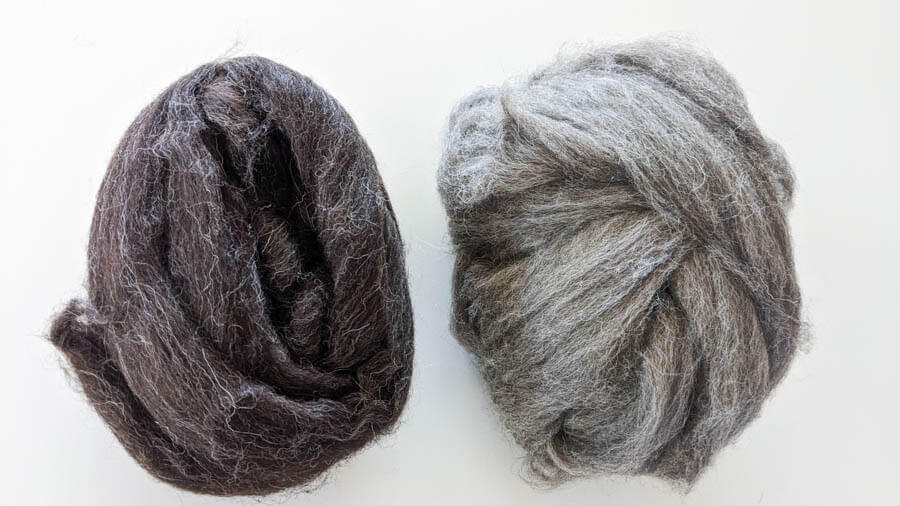 dark grey and light grey ball of fiber 