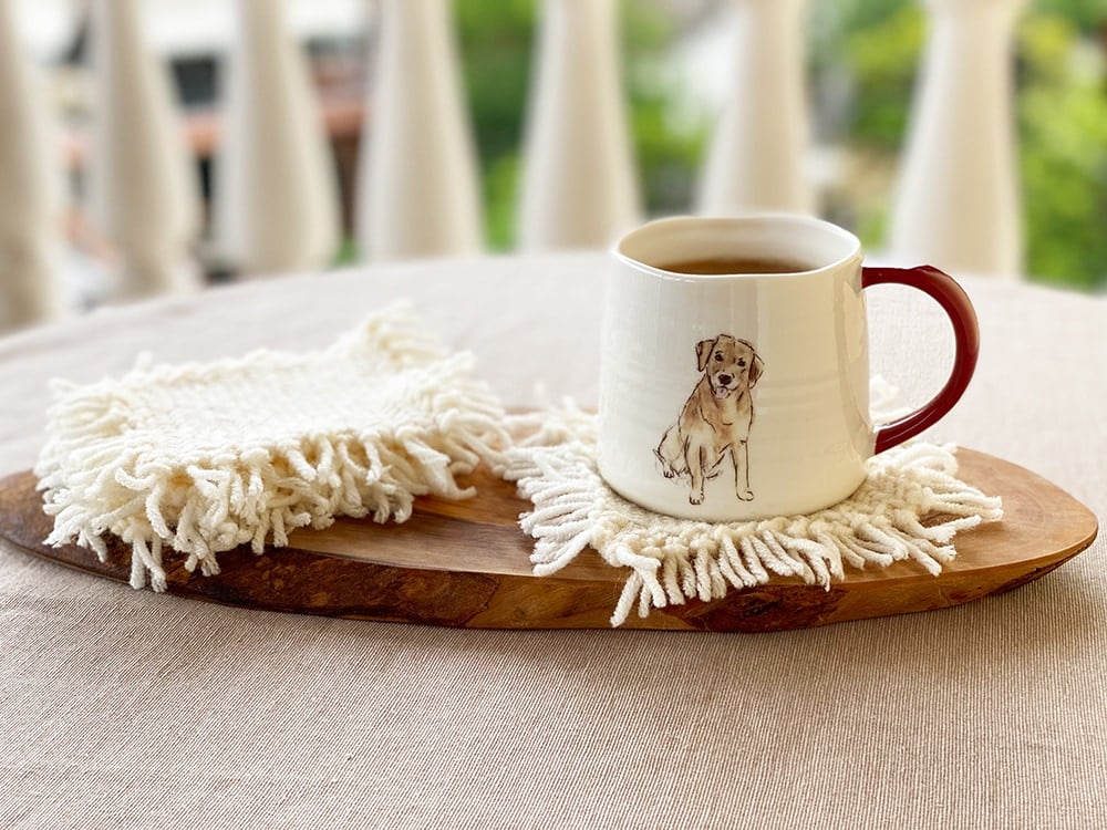 Handy Little me white knit coasters on a log platter 