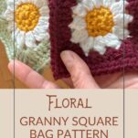 Close up of granny squares laid out on a wooden table. The squares are crochet in green, white, and yellow to resemble daisies with an alternate pattern using a red background instead of green.